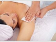 Therapist gives a soothing massage on a woman's shoulder in a tranquil spa setting. {{brizy_dc_image_alt imageSrc=